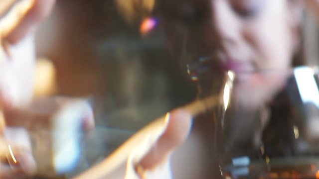 Drunk lady with glass of cognac texting message to ex-boyfriend, one-night stand