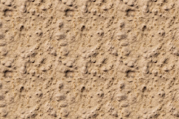 A beautiful horizontal texture of part of an old wall with yellow and orange plaster on the photo. Seamless pattern texture