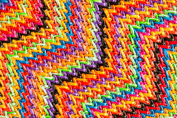 Abstract textured zigzag background of close up detail in woven raffia