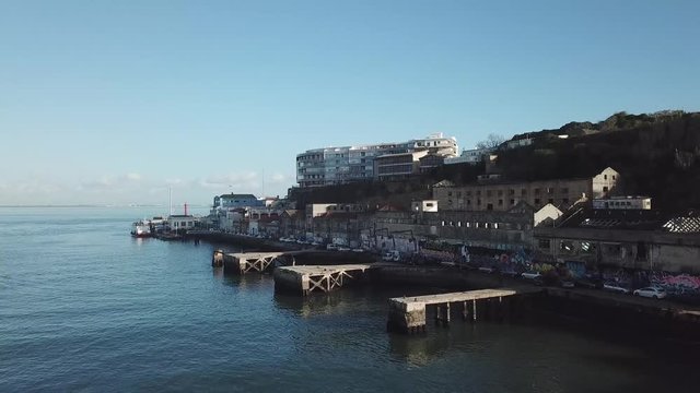 Birdview of Almada old docks and abandoned buildings along Tejo river