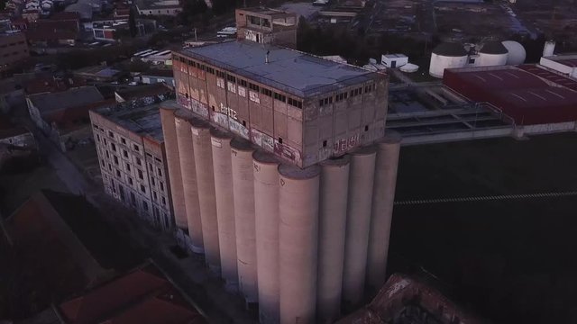 Birdview - Industrial building cilinder storage infrastructure at dusk