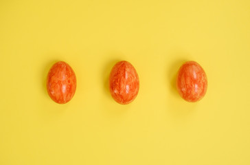 Easter eggs on yellow background.