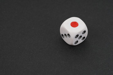 a dice over black surface