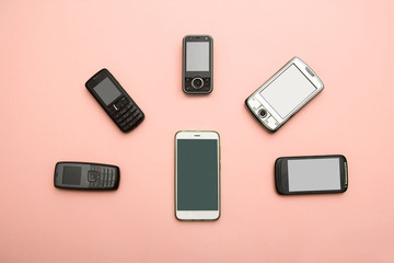 evolution of cell phones. Technology development telephone and pda concept. Vintage and new phones. Top view. Telephone communication progress, mobile classic device .