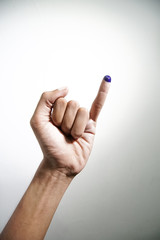 Inked blue finger of a man hand isolated on white background. blue ink blots from voters finger presidential election (pilpres) of indonesia.