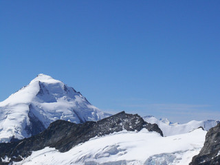 Fototapeta na wymiar Jungfrau, Switzerland. The top of the mountain. The mountain in this photograph seems to emerge from the snow