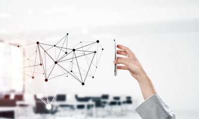 Business and technology concept with networking grid and man using device