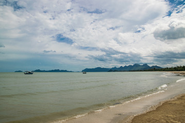 Pranburi beach with fishing boat 