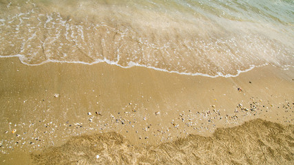 Fototapeta na wymiar Soft wave lapped the sandy beach, Summer Background