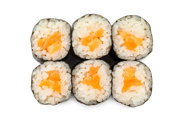 Top view closeup japanese classic sushi rolls with salmon isolated at white background.