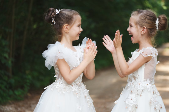 happy beautiful girls with white wedding dresses