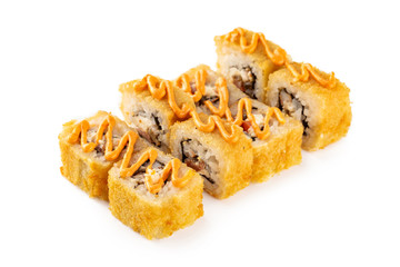 Closeup hot set of sushi rolls with eel, cheese served with sauce isolated at white background.