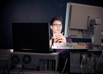 Young Man Spending His Night With Computers