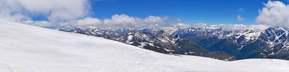 Fototapeta na wymiar Panoramic view of Caucasus Mountain Range. View from Elbrus mountain