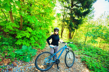 Fototapeta premium Young Woman Riding Her Mountain Bike