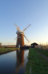 Fototapeta premium Horsey Windpump at sunset - Norfolk Broads, England, UK