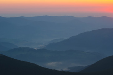 mountain silhouettes at sunset (sunrise)