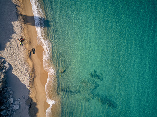 Beautiful beach with family top view shot