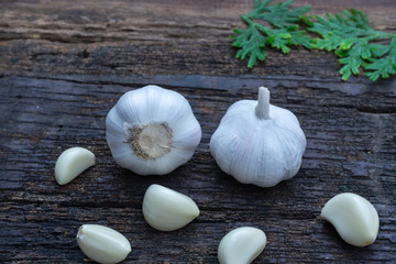 Top view of herbal vegetable ingredients, fresh garlic, on old wooden table, cooking preparation concept