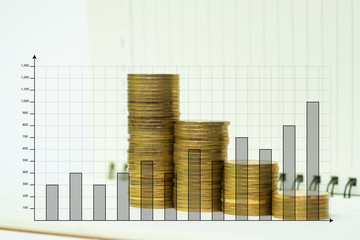 Obraz premium Step of coins stack on notebook paper with copy space for add text, financial and business planning concept.