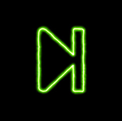 green neon symbol step forward