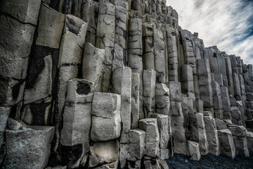 Beautiful and unique volcanic rock formation on Iceland black sand beach located near the village...