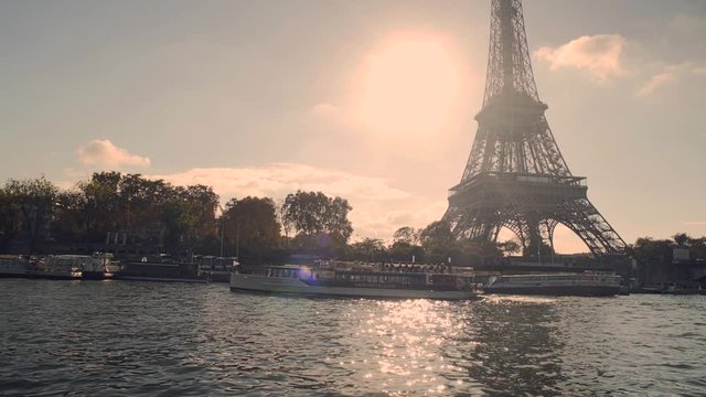 Reveal shot of Tour Eiffel Tower close up view and Seine River Paris, France