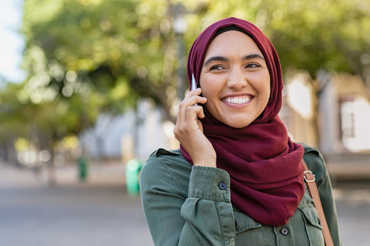 Young Woman In Hijab Talking On Phone