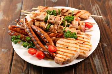 fried meats barbecue on wood background