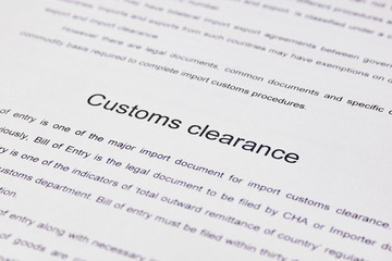 Page of paper with words Customs Clearance. Close-up