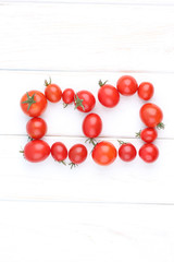 Fresh tomatoes on white backgrjund