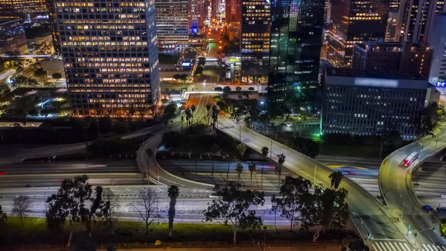 Los Angeles Urban Aerial Drone Time Lapse In Motion Or Hyperlapse At Night Flying Towards An Interstate With Traffic Showing The On And Off Ramp Circles Indicative Of The Fast Futuristic City Lifestyl