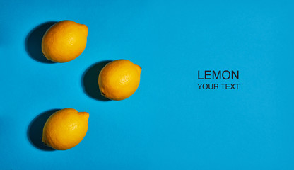 Creative layout made of lemon on blue background. Flat lay, top view, copy space . Food concept.