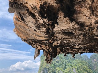 view of the deserted, clean beach on the background of hanging unique rocks of the island of...