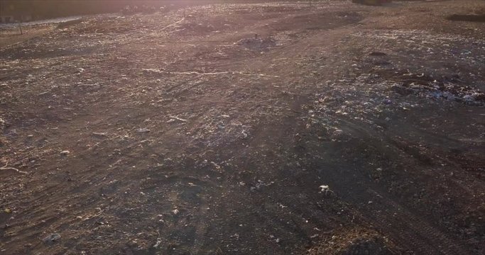 Aerial view of garbage pile in a landfill at sunset