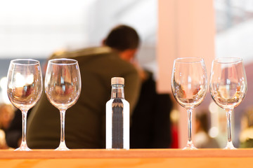 water  tasting sampling with glasses and people , selective focus
