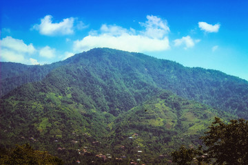 Obraz premium Mountain peaks landscape from a viewing platform close up with clouds, Batumi, Georgia.