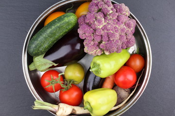 Fresh vegetables composition on black background