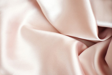 Tender pink pastel textile background with copy space. Pink fabric textures background, fabric uneven. Abstract blur of pink fabric for Wedding background. Pink silk fabric defocused for background.