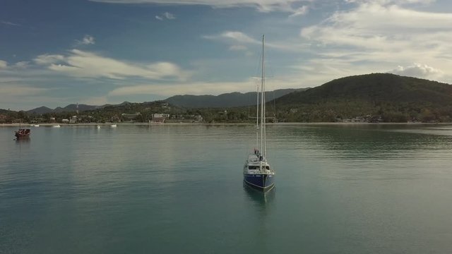 Aerial Scene of classic Sail Boat Anchored - circeling the boat - Koh Samui -Thailand