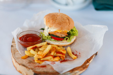 Homemade Burgers with Fried Potatoes and Tomato Sauce