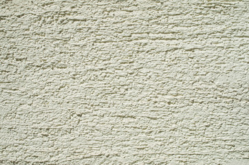 Fototapeta premium New green relief plaster on wall closeup