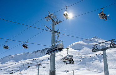 Many ski lifts crossing ski slope. Samnaun, Austria