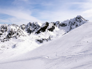 Winter landscape in the mountains and skier