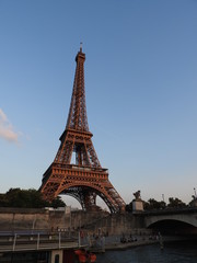 Fototapeta na wymiar Eiffel tower. Paris, France. The famous historical landmark on the Seine. Romantic, tourist, symbol of the greatness of architecture.