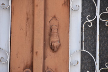 Fototapeta premium Mediterranean Brown Hand Door Knocker