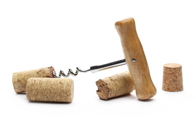 Corkscrew and wine corks isolated on white background