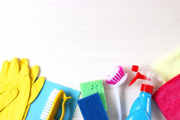  cleaning products on a colored background top view.
