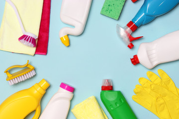  cleaning products on a colored background top view.
