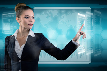 Young business lady works with virtual graphic interface in futuristic office